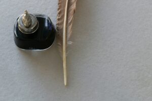 Ye olde quill feather pen and pot of ink